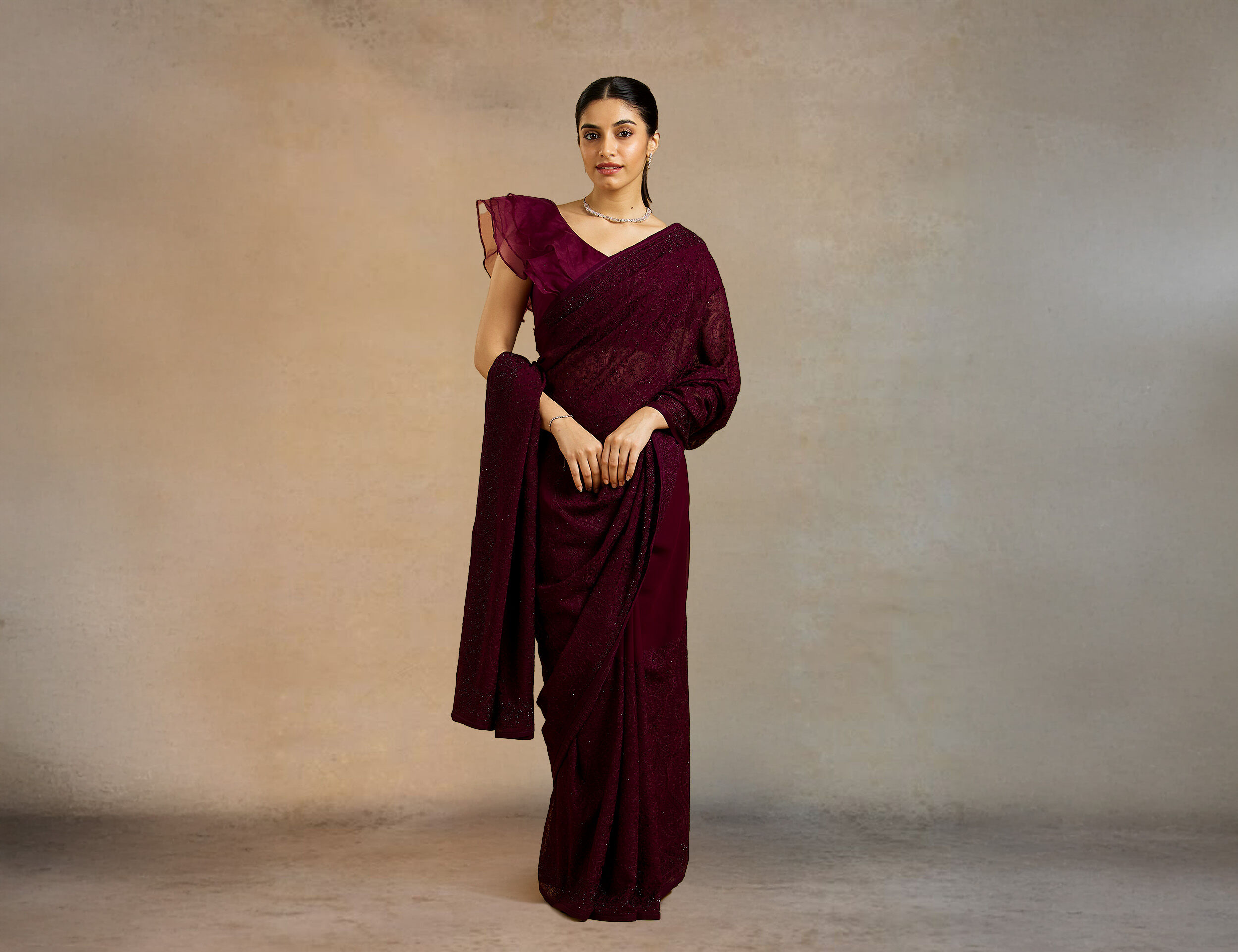 A silk saree elegantly draped in the traditional Nivi style.